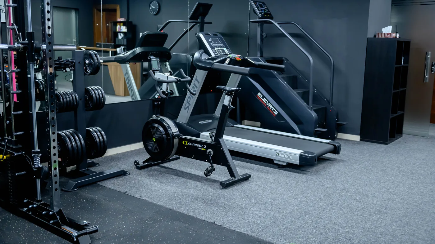 Cardio corner at the Elevate studio in Madinat Qaboos with rower, stair climber and treadmill