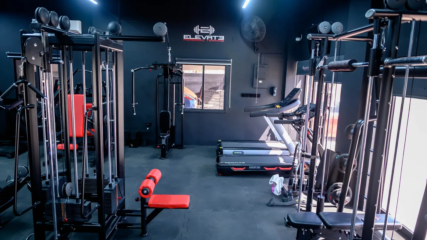 Azaiba Ladies 2 Training floor at the Elevate ladies-only gym in Azaiba with cable station, benches and treadmills